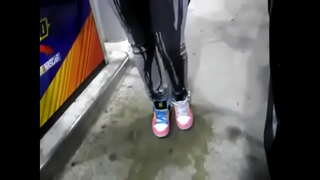 Desperate girl wetting pee jeans while pumping gas